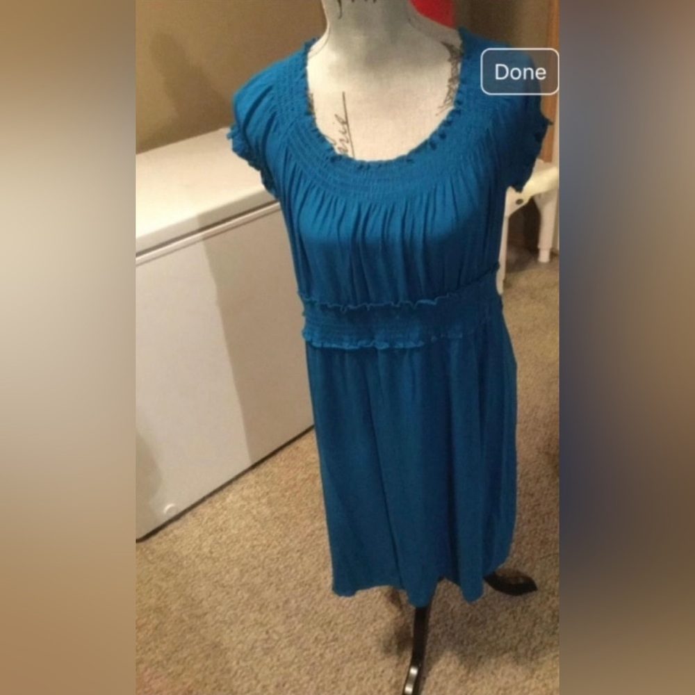 Teal coloured ruffled off the shoulder, empire waist dress